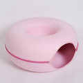 Cat inside donut bed